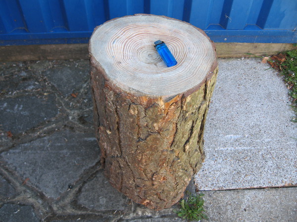 Metal doming block from log